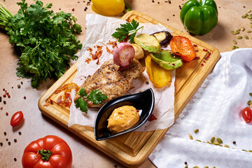 grilled steak with vegetables, onions and mustard