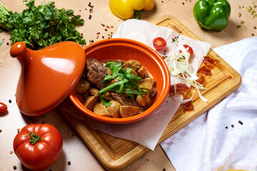 stew with potatoes and mushrooms in a pot