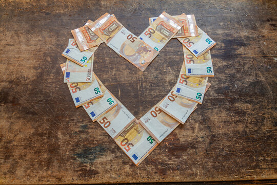Heart shaped empty frame made with many 50 euro banknotes isolated, Valentines day concept.