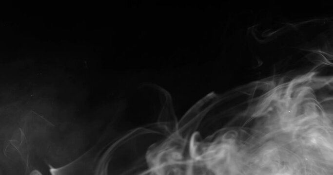 White smoke floating through space against black background	
