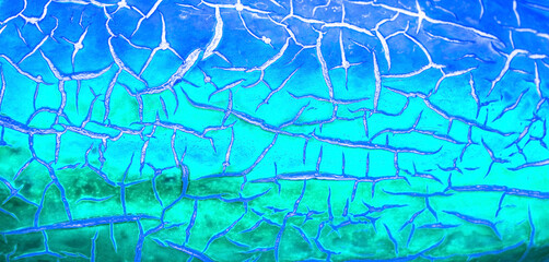 Abstract blue background with cracks.