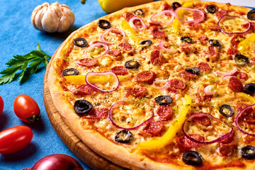 pizza with olives, sausage, onion, pepper