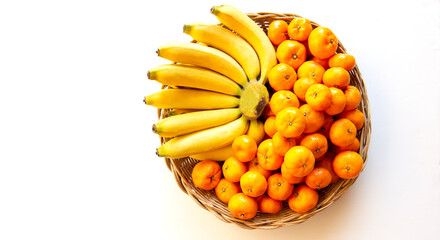Yellow banana and yellow tangerine in bamboo weave tray on white background.