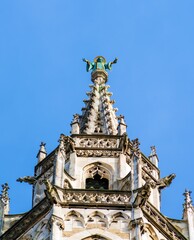 Fototapeta na wymiar Statue of monk on top of Rathaus, symbol of city, Munich, Germany
