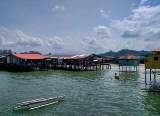 Houses on the water. Stilt villages in slums. Kota Kinabalu. State of Sabah on the island of Borneo. Malaysia. South-East Asia