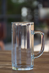 glass of beer on wooden table