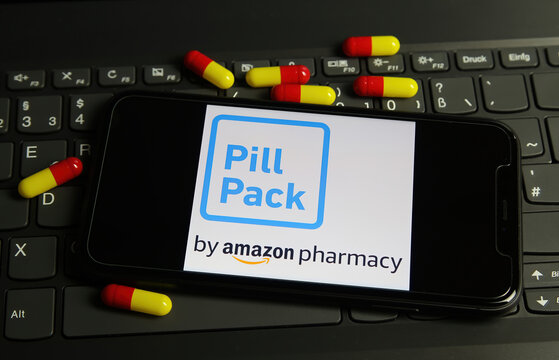 Viersen, Germany - February 9. 2021: Closeup Of Smartphone Screen With Logo Lettering Of Amazon Pharmacy Pill Pack On Computer Keyboard