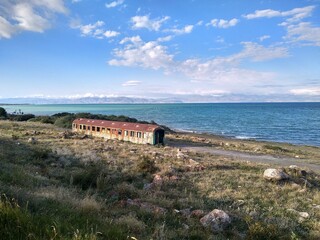 Abandoned rusty train wagon at the Sevan Lake in Georgia