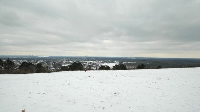 [4k] panning shot over ruhr valley from snowy halde haniel