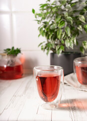 hibiscus tea,rose tea ceremony. Cup of freshly brewed fruit tea, light moody. the bright interior
