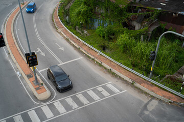 Car waiting at the traffic light junction.Arial view of road.