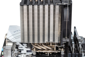 Macro shot of a modern desktop motherboard with a heatsink mounted on the CPU on the socket LGA.