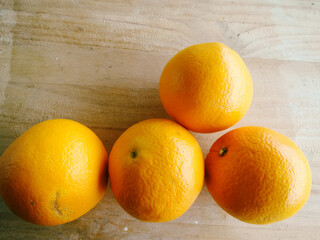 Oranges group over wood table