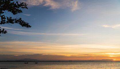 Naklejka na ściany i meble Sunset sky over sea in the evening with colorful sunlight, dusk sky