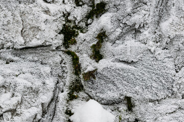 Irregular stone flags, frosted over, seen from above