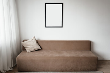 Comfortable vilure sofa in the living room with a picture on the wall. Interior
