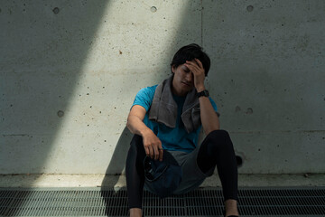 運動中に体調を崩した男性