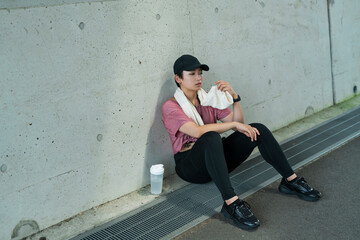 運動中に体調を崩した女性