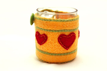Mug with a knitted cover with red hearts. Valentine's day gift. Cosy souvenirs.