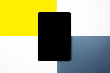 Mock up of a tablet on different colored backgrounds.