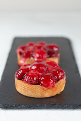 Fresh pastries, cakes from the bakery on a light background