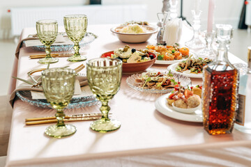 Beautiful festive table, with Greek salad with feta cheese.