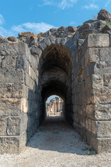 Fototapeta na wymiar Ached entrance to the amphitheater at Bet She'an Israel