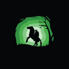 Silhouette of Cowboy riding horses