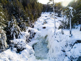 River aerial view of winter flowing waters