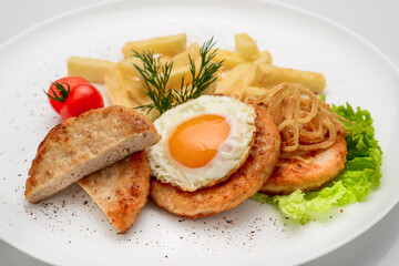Beef rissole, juicy beef steak with egg and potatoes