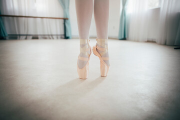 Close up of ballerina legs on pointe shoes 