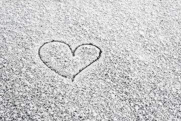 Heart painted on snow and there are and Many grains of white snow and snowflakes, concept February 14