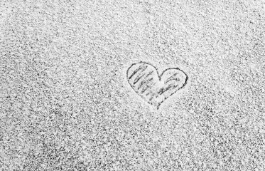 close-up heart scrawled on icy snow, frosty window, cold heart, card for Valentine's day