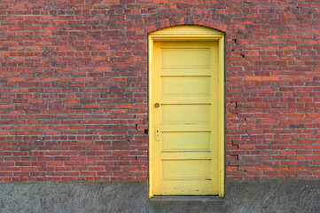 red brick wall with door