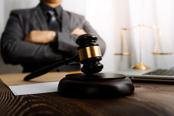 justice and law concept.Male judge in a courtroom on wooden table and Counselor or Male lawyer...