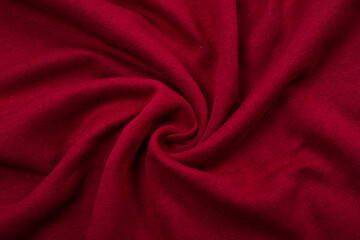 Obraz premium Pleats on fabric, knitted material of Crimson color, folds