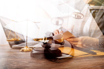 Business and lawyers discussing contract papers with brass scale on desk in office. Law, legal services, advice, justice and law concept