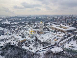 Kiev Pechersk Lavra, covered with snow. Cloudy winter morning. Aerial drone view.