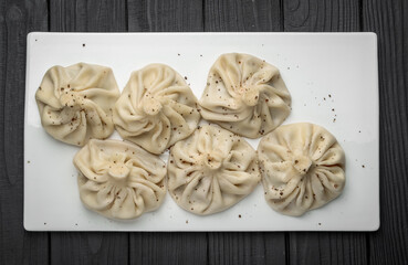 Khinkali cooked on a ceramic plate