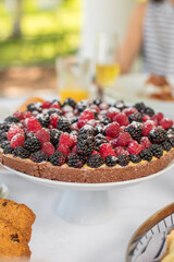 Delicious raspberry  tart (tartlet) with whipped cream. Breakfast Buffet Concept, Breakfast Time. Various brunch on the table
