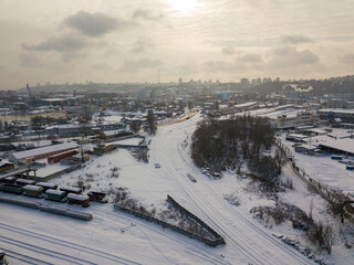 Snowy industrial area of Kiev. Aerial drone view. Winter snowy day.
