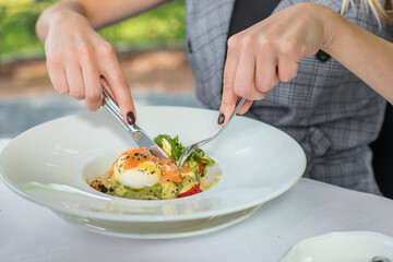 Eggs Benedict on toasted muffins with ham and sauce. Breakfast Buffet Concept, Breakfast Time. Various brunch on the table