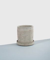Creative diagonal isometric projection. Composition with concrete flower pot. blue and white background. Minimalism. Natural material