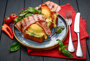 Eggs Benedict- toasted , bacon, poached eggs, and delicious buttery hollandaise sauce