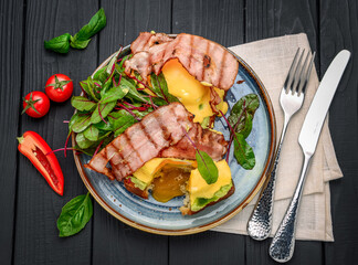 Eggs Benedict- toasted , bacon, poached eggs, and delicious buttery hollandaise sauce