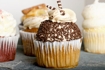 Cupcakes for dessert food with sprinkles close up.