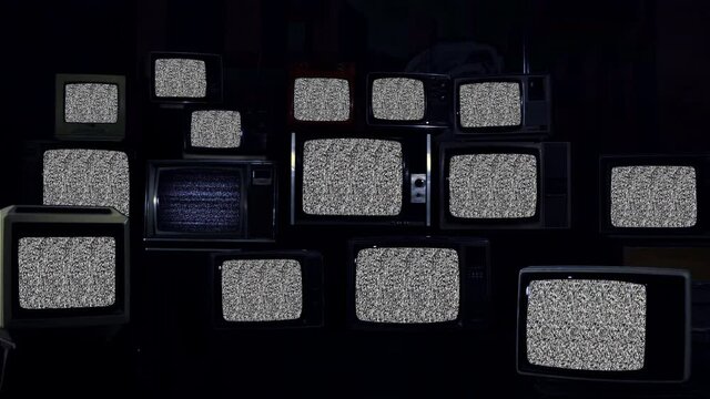 Pile of Vintage TVs turning on Static TV and Five Retro TVs turning On Green Screens. Dark Tone. 4K Resolution.