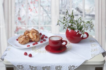 Still life with coffee and sweets against the  white background 