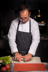 Chef preparing cookies in his kitchen.