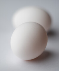 two eggs, one out of focus